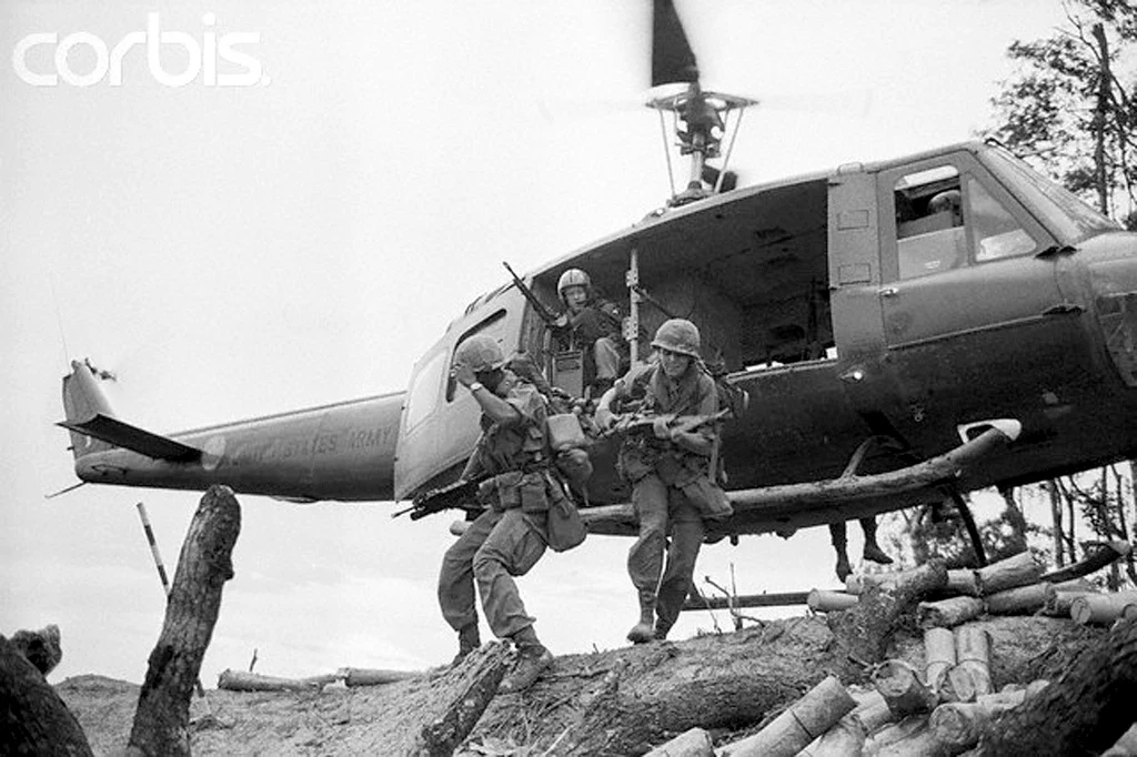 Soldiers from the U.S Army exiting a helicopter.