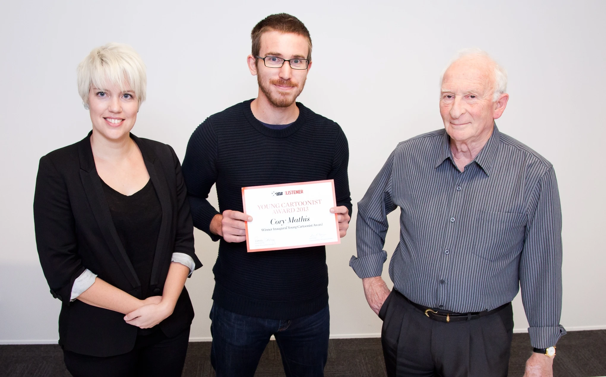 Cory Mathis, winner of the Young Cartoonist Award (centre) with Melinda Johnston and Ian Grant, 2013.