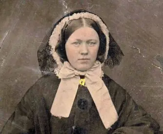 The faded image of Eliza Mary Ellis on a black laquered card.
