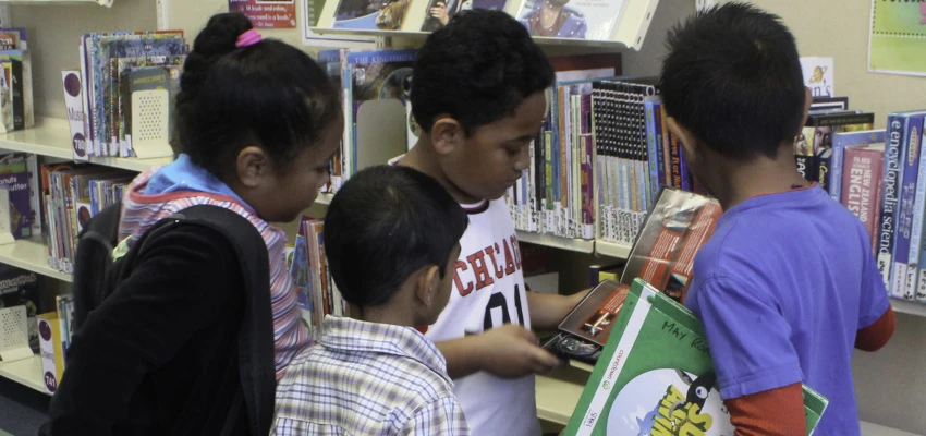 Children sharing a book.