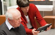 Librarians logging in on a tablet.