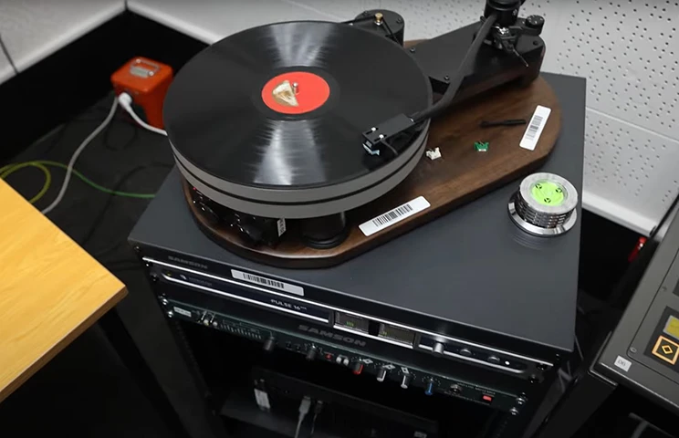 Photo of a record on a record player. 