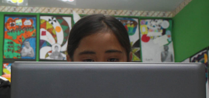 Girl using a laptop.