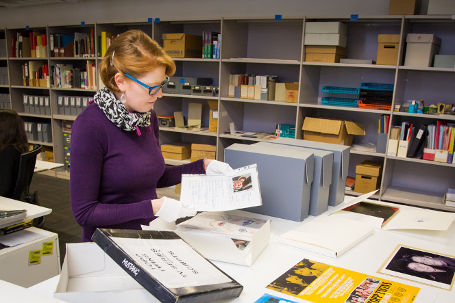 Valerie working on processing the Diva Productions Ltd: Records of the Topp Twins collection.