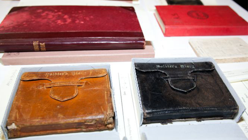 Leather-bound books on a table. 