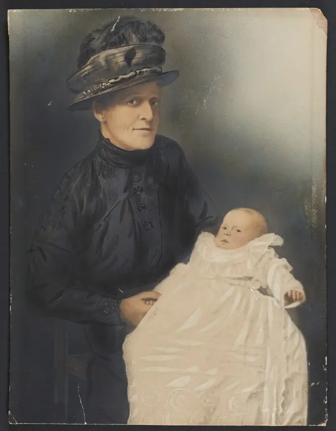 Hand coloured version of the previous image of a woman and baby.