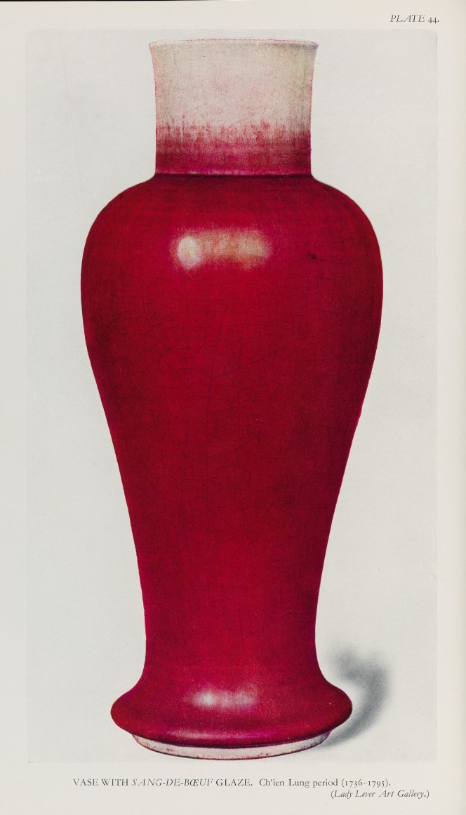 A red glazed vase.