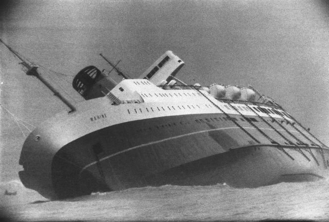 Ship Wahine sinking in Wellington Harbour, 11 April 1968. Shows the port side.