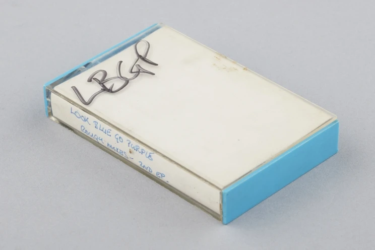 Close-up of the cassette cover with paper insert and blue back.