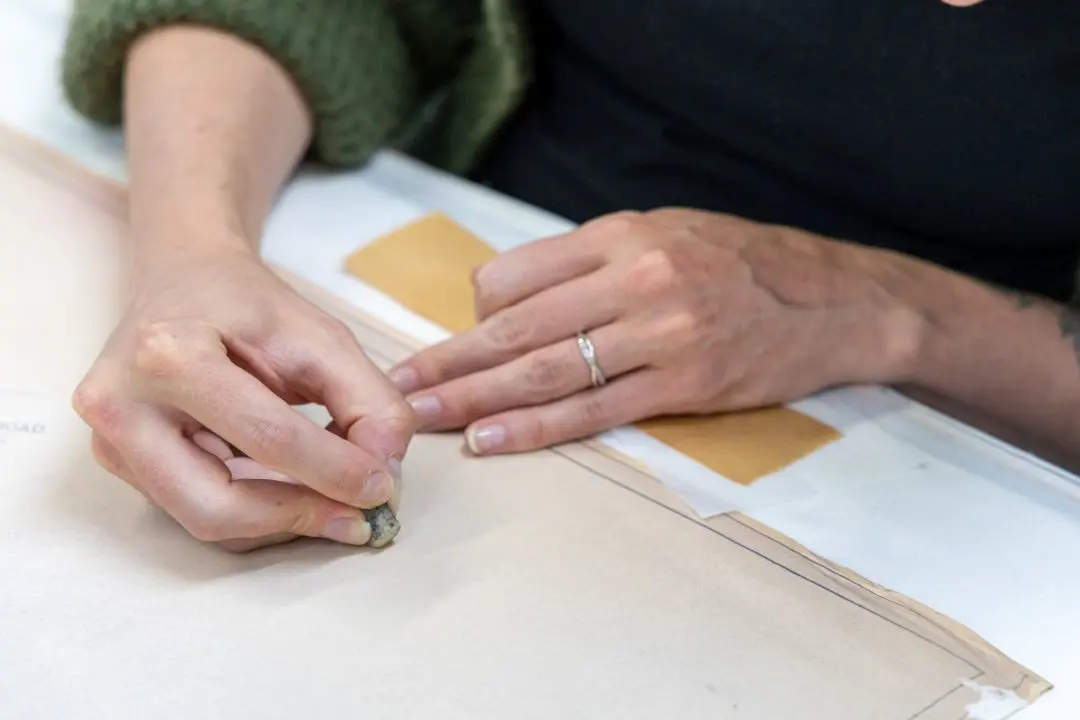 Laura uses a crepe eraser to gently remove adhesive residue