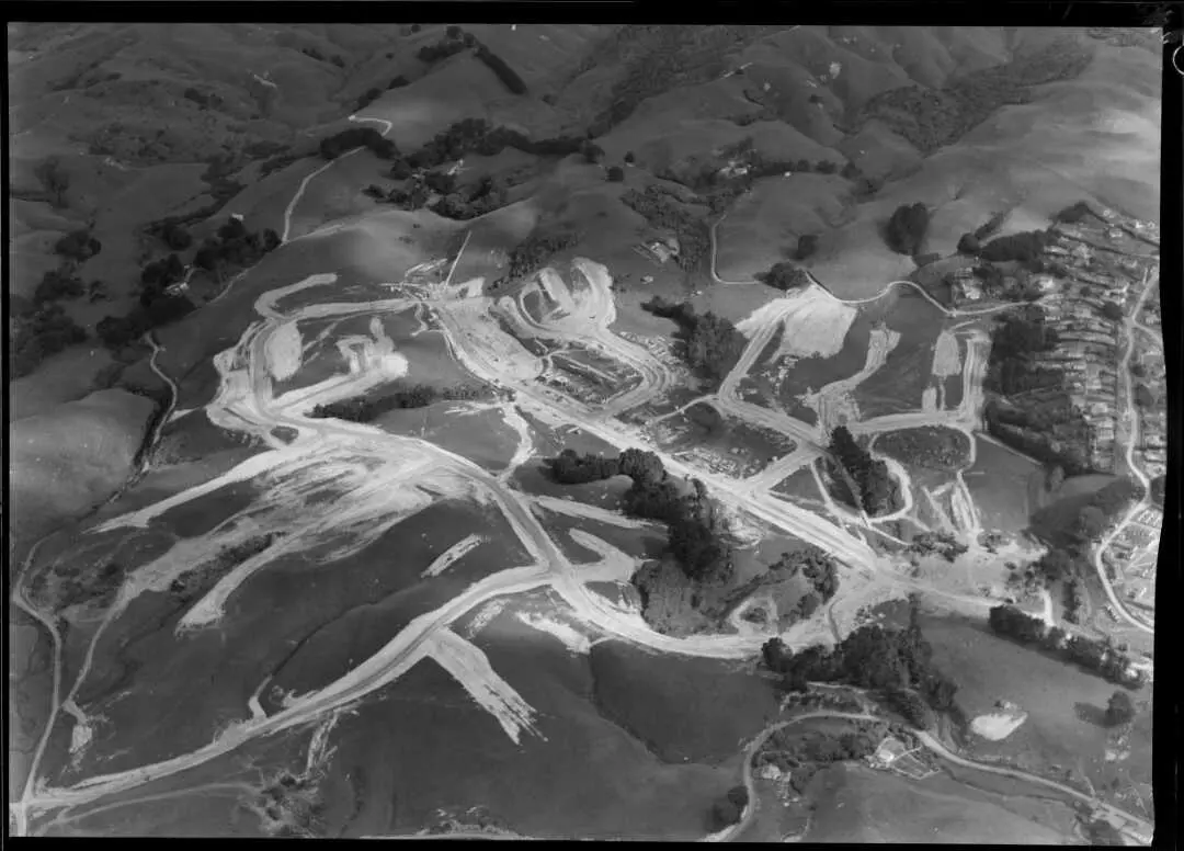 Porirua housing site showing roads but no houses built yet, viewed from above, Wellington, 27 November 1949. Ref: WA-23366-F.