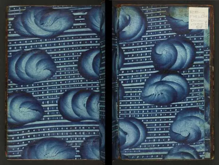 Blue paste endpaper. Blue paste has been spread in lines and then swirled to form the pattern.