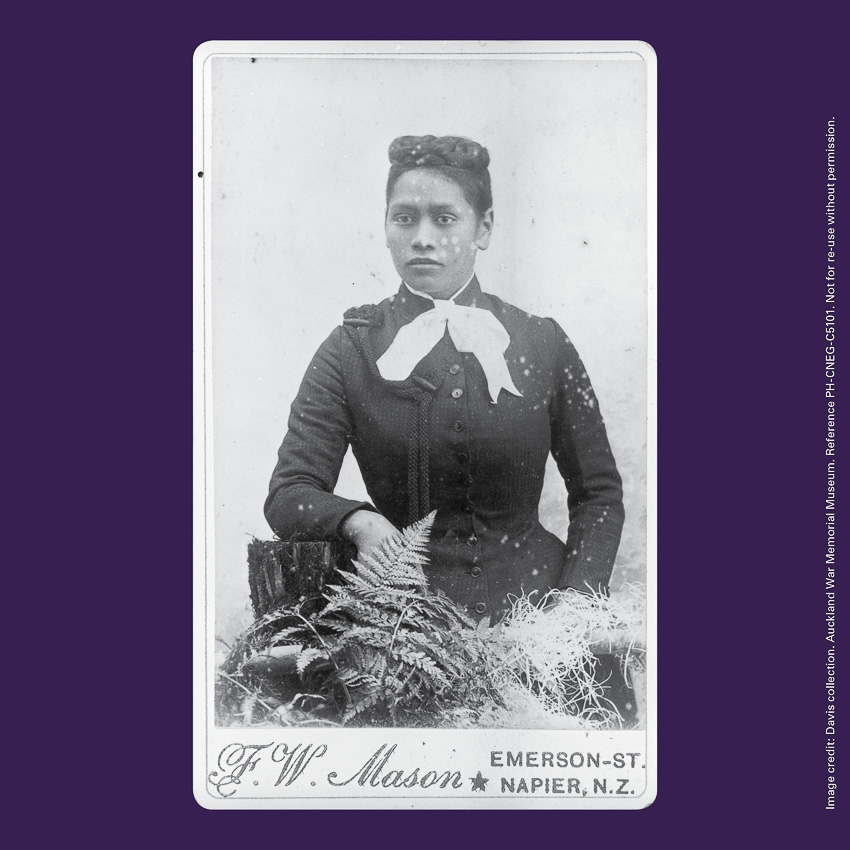 Front of curiosity card CC0010, with a portrait image of Meri Te Tai Mangakāhia seated with plants. The words 'F W Mason Emerson Street Napier NZ