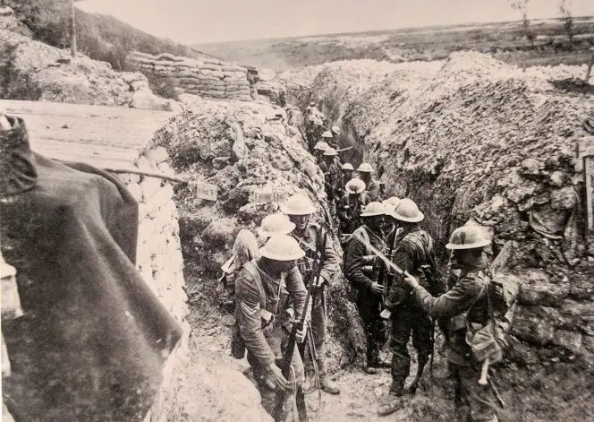 Still showing soldiers affixing bayonets to their rifles before going over the top on 1916.