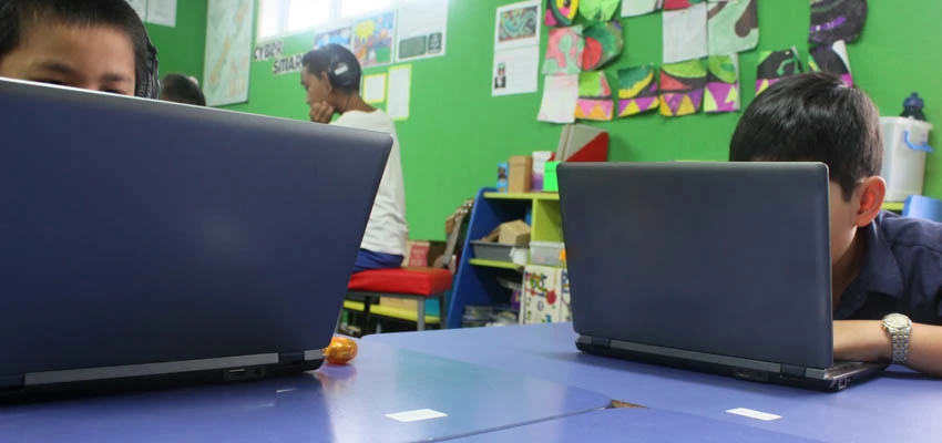 Students using their laptops.