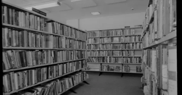 Library shelves, probably taken for Dobbs-Wiggins McCann-Erickson 1972 by K E Niven and Co, commercial photographers of Wellington.