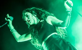 Lorde performing at a concert. Image credit: Photo by digboston. CC BY 2.0. Image cropped.