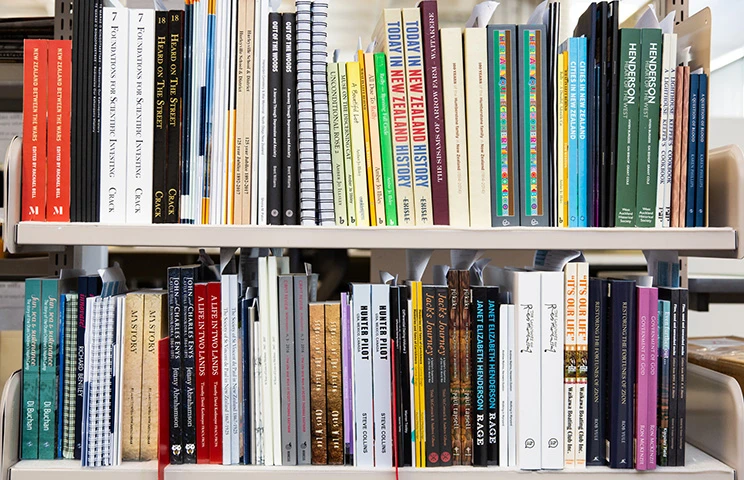 A cropped photo of two shelves of books. 