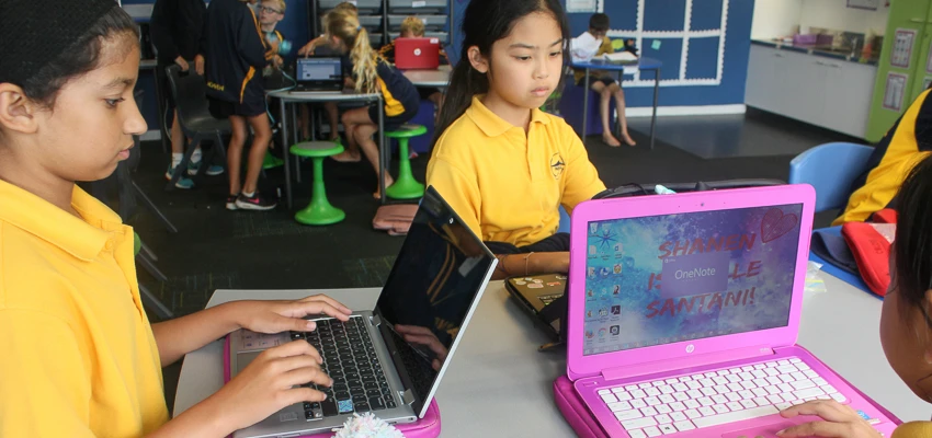 School children working with laptops in the classroom.