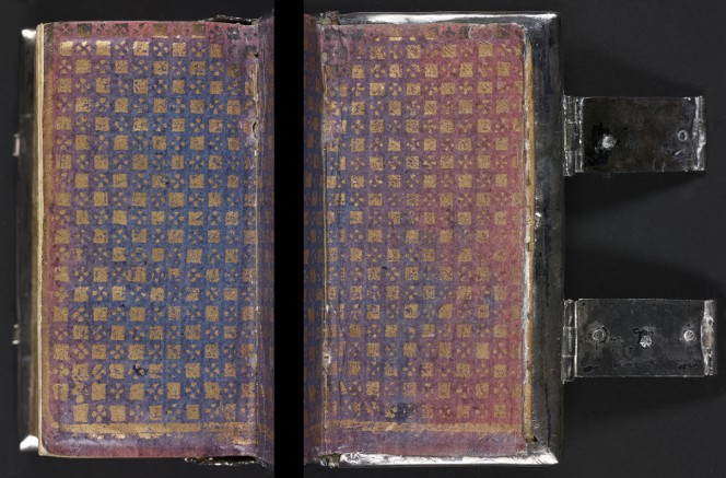 Gilt, blue, and red endpaper on a silver-bound book.