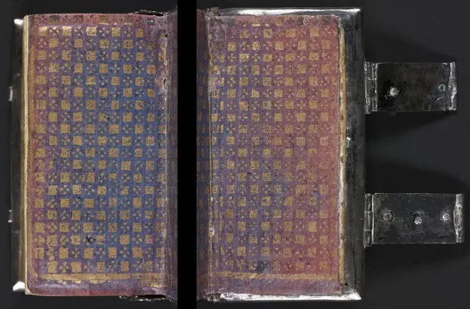 Gilt, blue, and red endpaper on a silver-bound book.