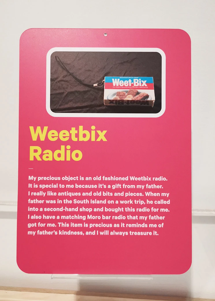 Pink label with words "Weetbix" radio, photo of the weetbix radio and text about how this was a gift from the person's father and it reminds them of their father's kindness. 