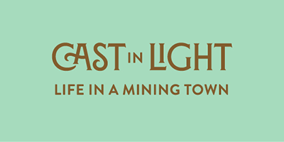 Cast in light, life in a mining town. 