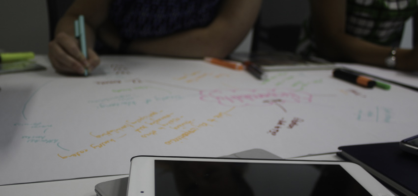 School library staff doing brainstorming exercise on paper.