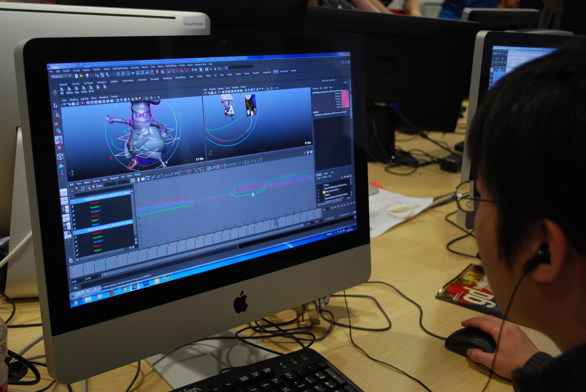 A boy on a Mac computer at The Gamer Camp Studios.