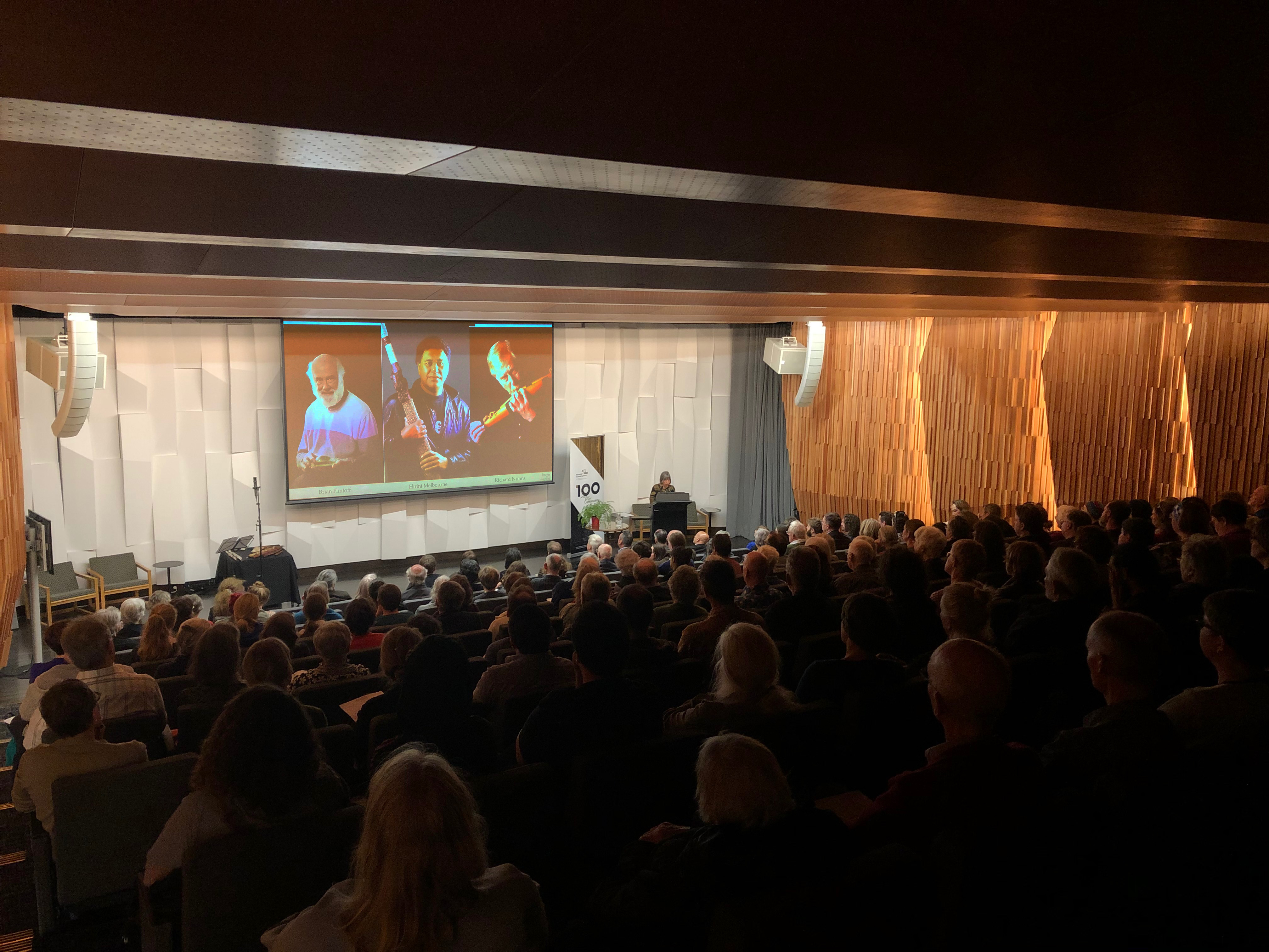 View from the back of the auditorium showing a full house.