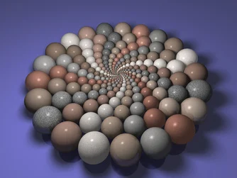 Myriads of three-dimensional CGI balls/marbles grouped to form a circle. Marbles shrink in size as they spiral in toward the centre