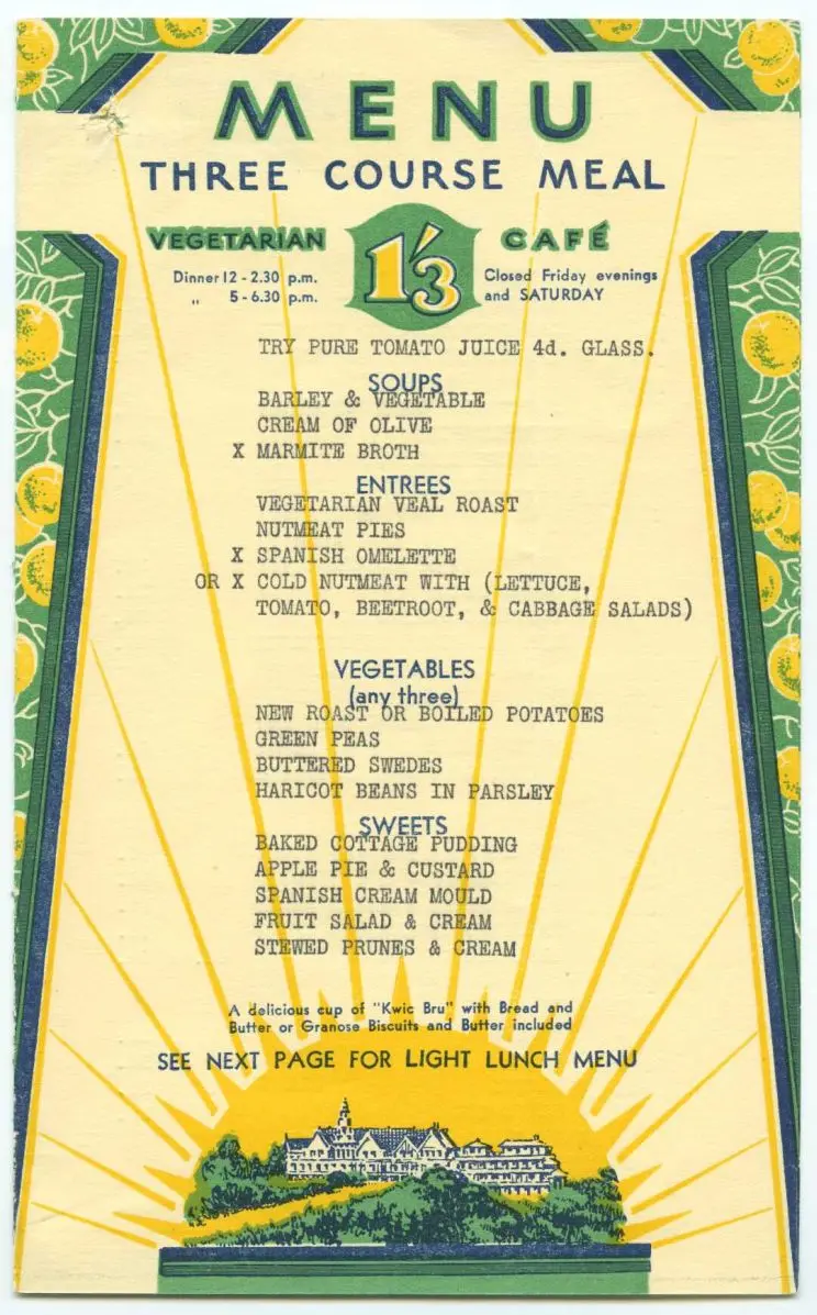 A menu cover designed in green and yellow on cream shows lemons, and the sun rising over a large country building. The menu has soups, entrees, vegetables and sweets, the entrees including nutmeat products and "vegetarian veal". 