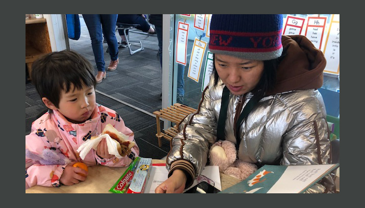 Woman reading to a child