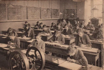 Old sepia photograph of industrious engineering students in a classroom, deeply focused on the work they are doing 