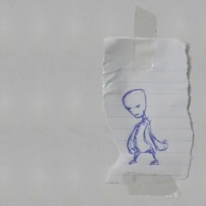 A pen-drawn figure with large smooth head has been drawn on lined paper and taped to a white background.