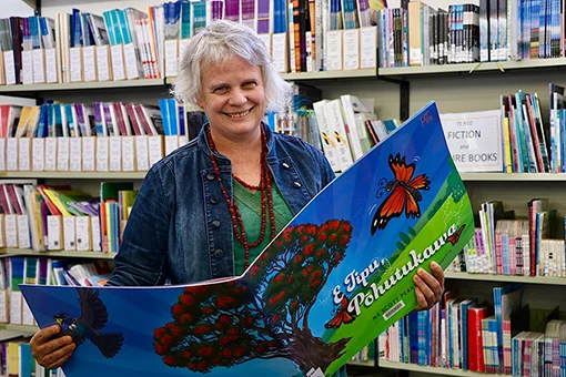 Woman with a large picture book. 