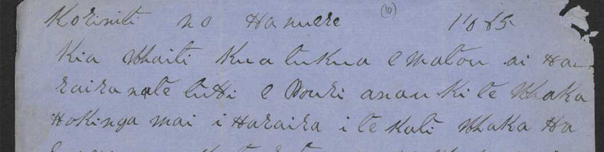 Beautiful handwriting in te reo Māori on blue writing paper.
