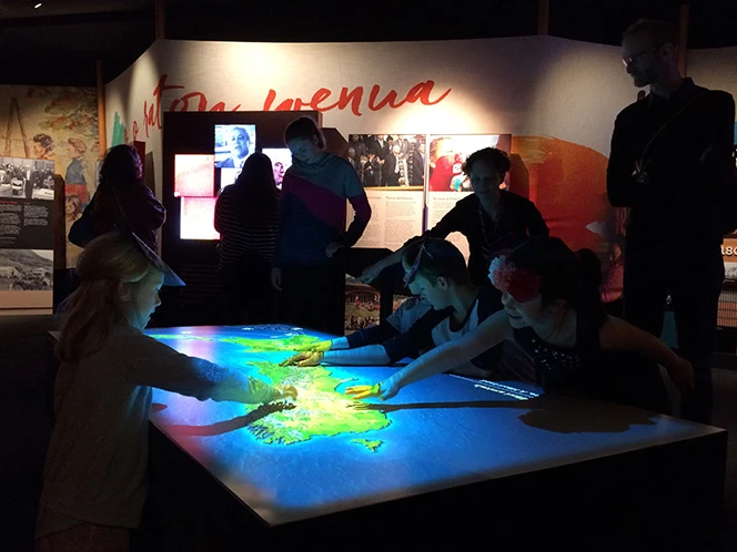 Children at a digital map table showing where the Treaty sheets travelled. 