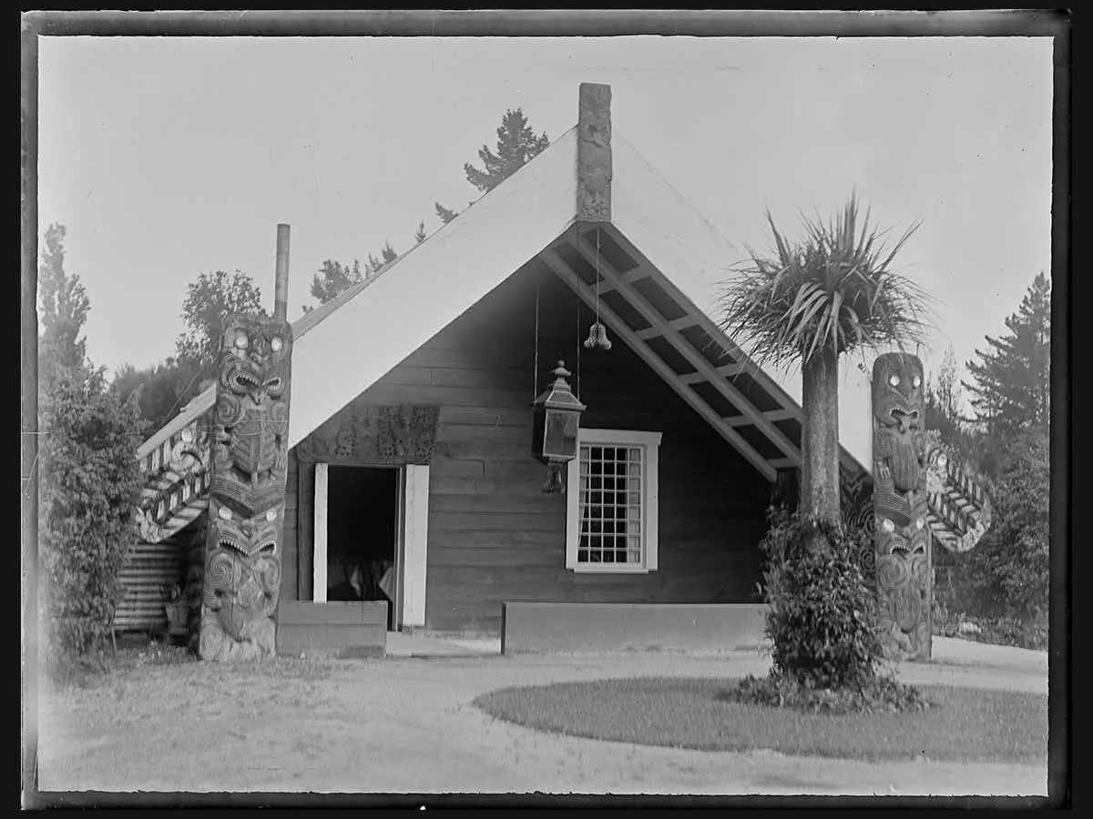 Black and white photo of a wharenui on a marae in the Taupō District. 