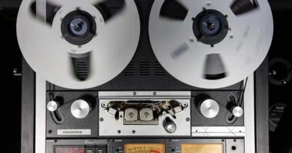 Tape spooling on a tape recorder in preparation for playback and digitisation.