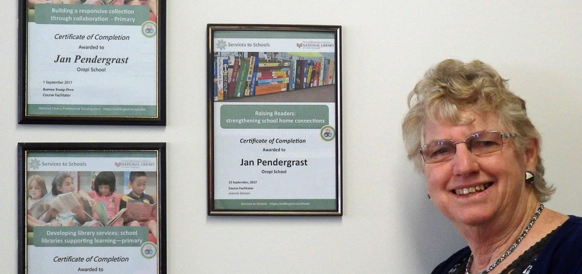 School Librarian Jan Pendergrast with her certificates from her National Library online professional development courses