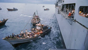 Boat refugees being rescued.