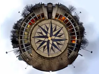 A strange circular view of a building, evocative of a compass.