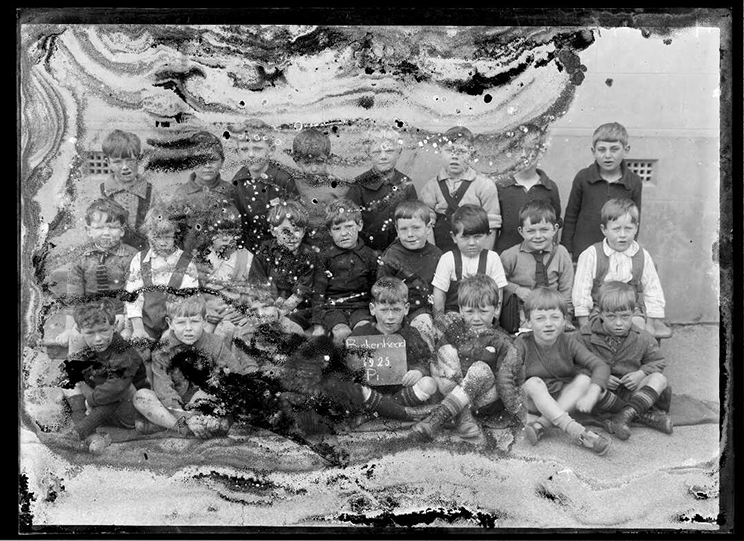 Class photograph that has been damaged over time. 