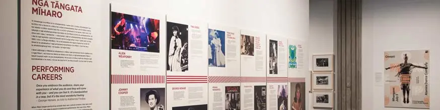 Images hanging on a wall of Māori performers showcased in Pūkana.