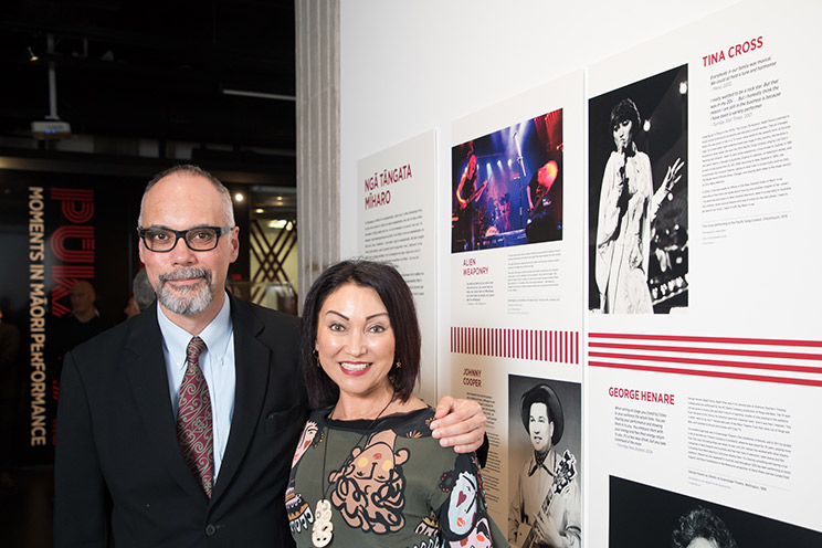 Curator Pual Diamond and singer Tina Cross in front of an exhibition panel about Tina Cross.