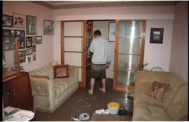 Man is a flooded room. 