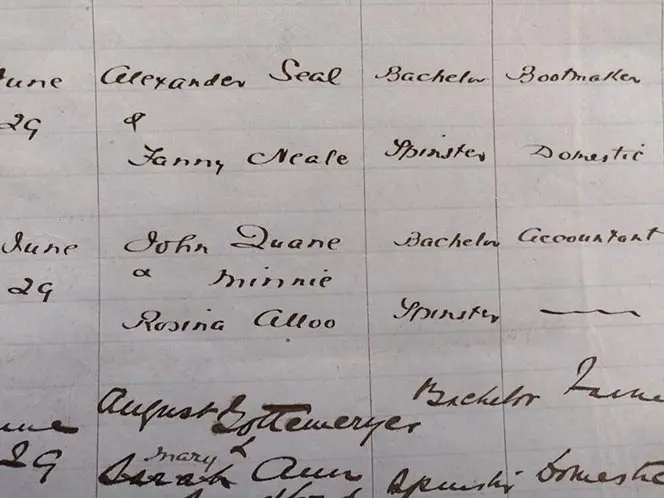 Signatures of John Quane and Minnie Alloo in a register showing their intention to marry.