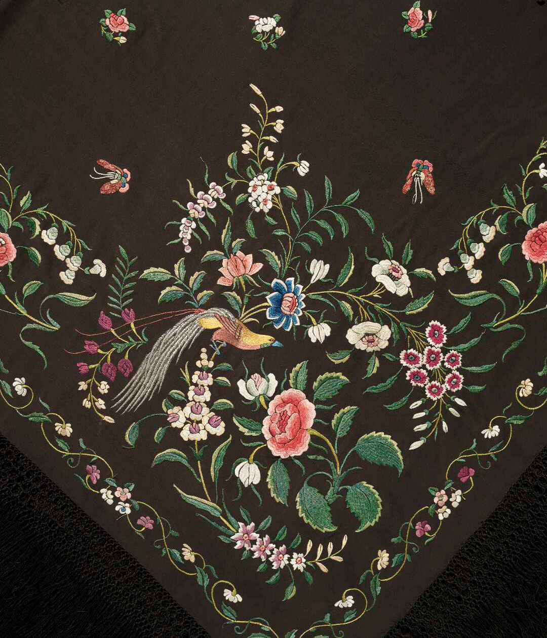 Detail of a shawl embroidered with bird, butterflies and flowers. 