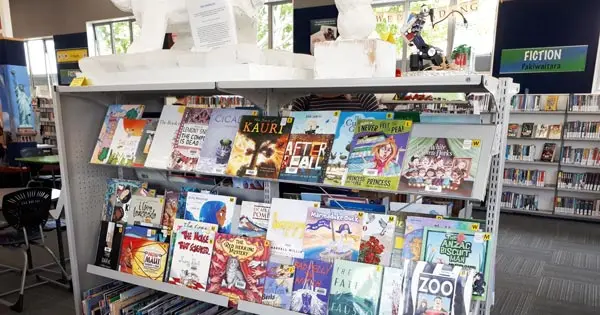 Book display in a school library with colourful children's books.